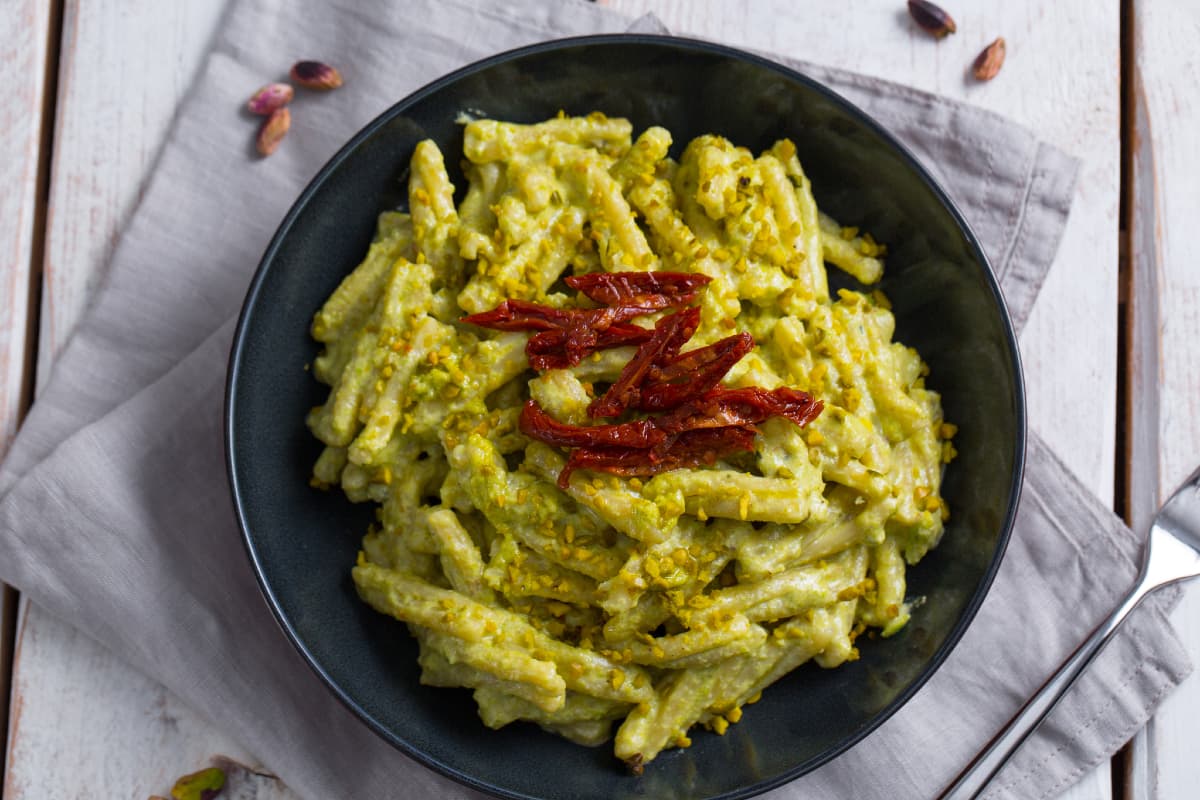 A beautiful plate of pistachio pesto pasta made with California pistachios
